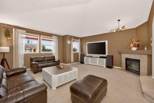 137 Douglas Glen Manor Se, Calgary, AB - Indoor Photo Showing Living Room With Fireplace