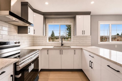 755 Penbrooke Road Se, Calgary, AB - Indoor Photo Showing Kitchen With Double Sink