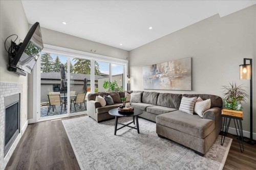 3127 44 Street Sw, Calgary, AB - Indoor Photo Showing Living Room With Fireplace