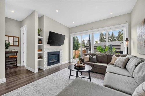 3127 44 Street Sw, Calgary, AB - Indoor Photo Showing Living Room With Fireplace