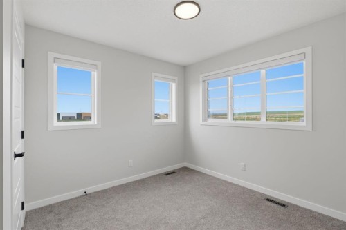 212 Lewiston Landing Ne, Calgary, AB - Indoor Photo Showing Other Room