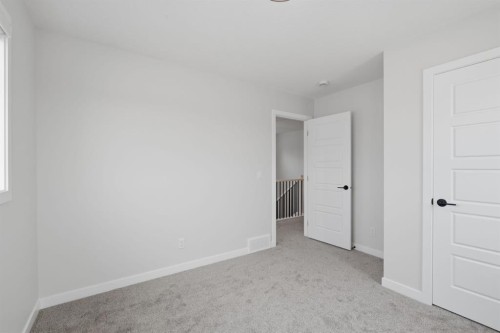 212 Lewiston Landing Ne, Calgary, AB - Indoor Photo Showing Other Room