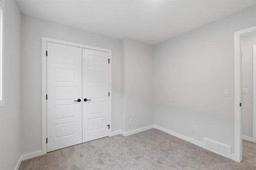 212 Lewiston Landing Ne, Calgary, AB - Indoor Photo Showing Other Room