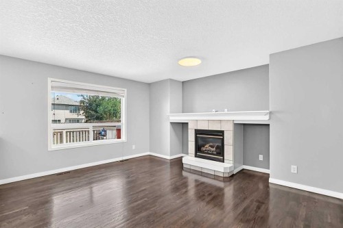 12871 Coventry Hills Way Ne, Calgary, AB - Indoor Photo Showing Living Room With Fireplace