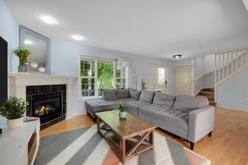 5532 Forand Street Sw, Calgary, AB - Indoor Photo Showing Living Room With Fireplace