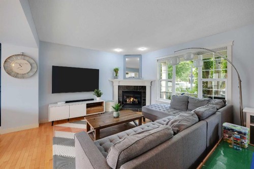5532 Forand Street Sw, Calgary, AB - Indoor Photo Showing Living Room With Fireplace