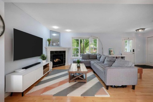 5532 Forand Street Sw, Calgary, AB - Indoor Photo Showing Living Room With Fireplace