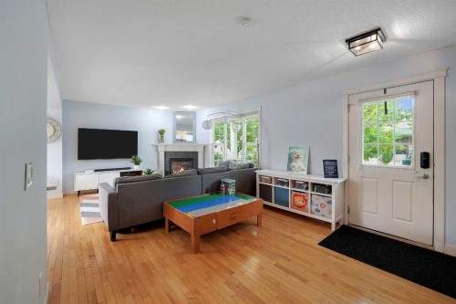 5532 Forand Street Sw, Calgary, AB - Indoor Photo Showing Living Room With Fireplace