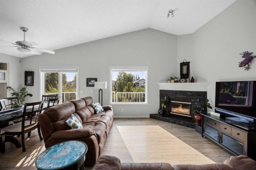 354 West Creek Springs, Chestermere, AB - Indoor Photo Showing Living Room With Fireplace