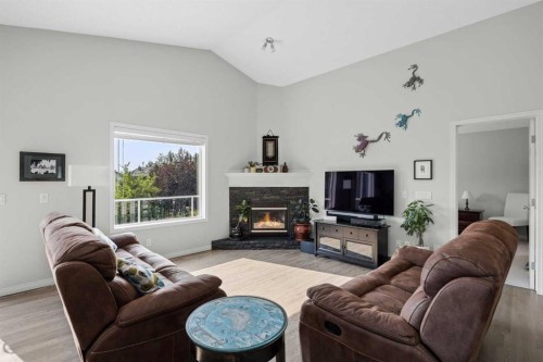 354 West Creek Springs, Chestermere, AB - Indoor Photo Showing Living Room With Fireplace