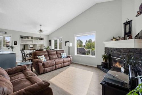 354 West Creek Springs, Chestermere, AB - Indoor Photo Showing Living Room With Fireplace