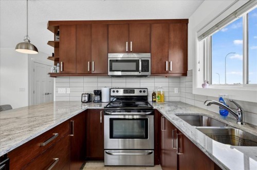 24 Auburn Meadows Green Se, Calgary, AB - Indoor Photo Showing Kitchen With Stainless Steel Kitchen With Double Sink With Upgraded Kitchen