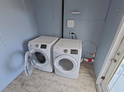 4809 52 Street, Stavely, AB - Indoor Photo Showing Laundry Room