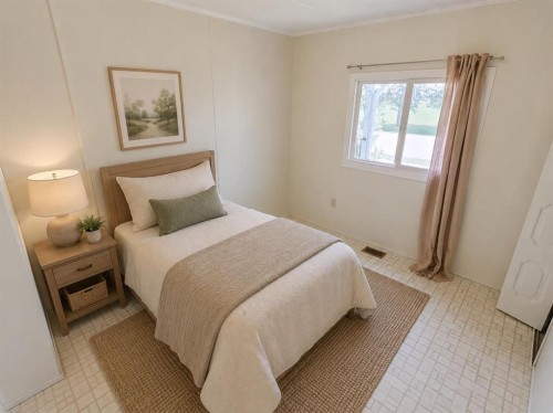 4809 52 Street, Stavely, AB - Indoor Photo Showing Bedroom