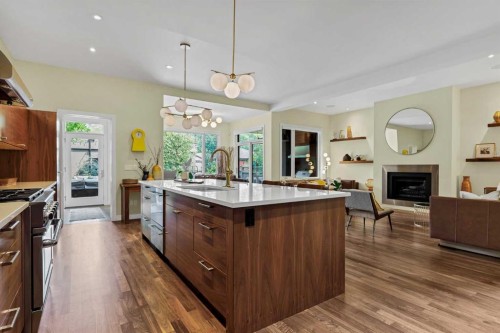 2330 7 Avenue Nw, Calgary, AB - Indoor Photo Showing Kitchen With Fireplace