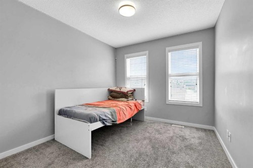 75 Evanscrest Way Nw, Calgary, AB - Indoor Photo Showing Bedroom
