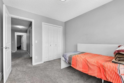 75 Evanscrest Way Nw, Calgary, AB - Indoor Photo Showing Bedroom
