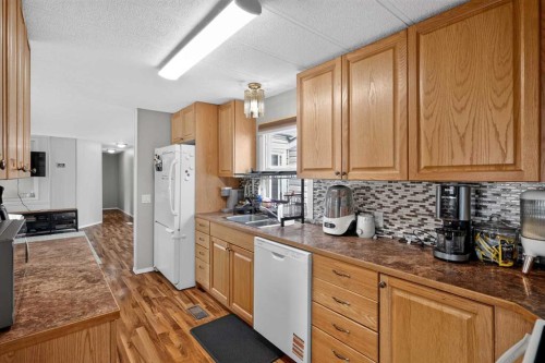 913 Spring Haven Court Se, Airdrie, AB - Indoor Photo Showing Kitchen With Double Sink