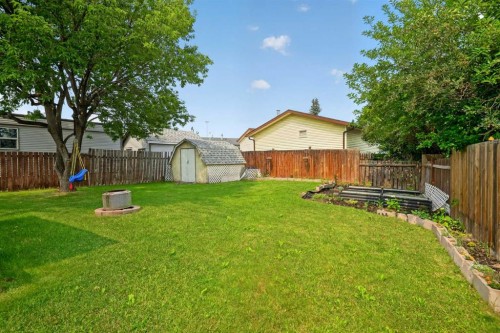 913 Spring Haven Court Se, Airdrie, AB - Outdoor With Backyard