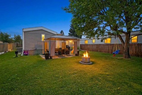 913 Spring Haven Court Se, Airdrie, AB - Outdoor With Backyard