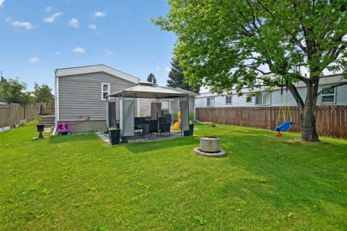 913 Spring Haven Court Se, Airdrie, AB - Outdoor With Backyard