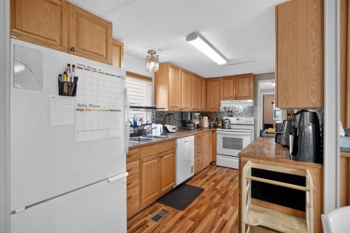 913 Spring Haven Court Se, Airdrie, AB - Indoor Photo Showing Kitchen With Double Sink