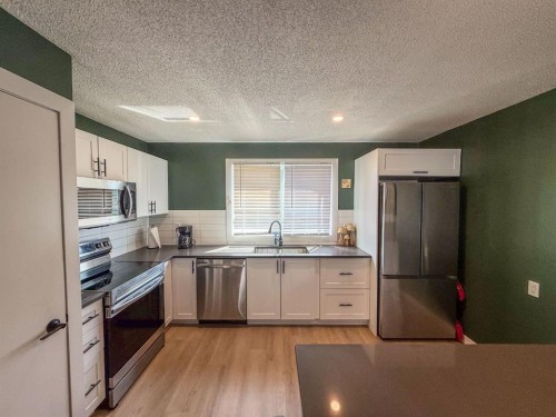 119 Fallswater Crescent Ne, Calgary, AB - Indoor Photo Showing Kitchen With Stainless Steel Kitchen