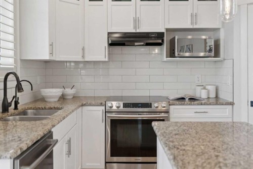 1826 Baywater Street Sw, Airdrie, AB - Indoor Photo Showing Kitchen With Double Sink With Upgraded Kitchen