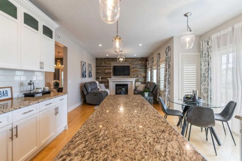 1826 Baywater Street Sw, Airdrie, AB - Indoor Photo Showing Other Room With Fireplace