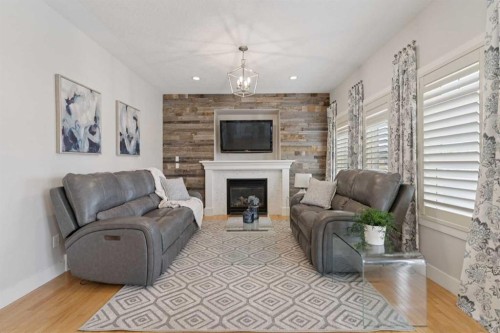 1826 Baywater Street Sw, Airdrie, AB - Indoor Photo Showing Living Room With Fireplace