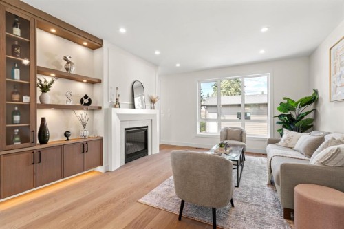 8140 47 Avenue Nw, Calgary, AB - Indoor Photo Showing Living Room With Fireplace