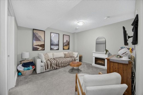 146 Sunset Road, Cochrane, AB - Indoor With Fireplace