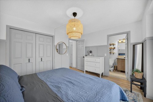 146 Sunset Road, Cochrane, AB - Indoor Photo Showing Bedroom