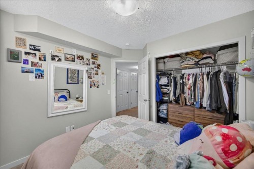 146 Sunset Road, Cochrane, AB - Indoor Photo Showing Bedroom