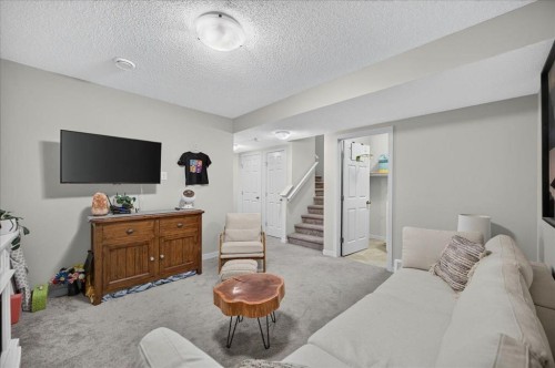 146 Sunset Road, Cochrane, AB - Indoor Photo Showing Bedroom