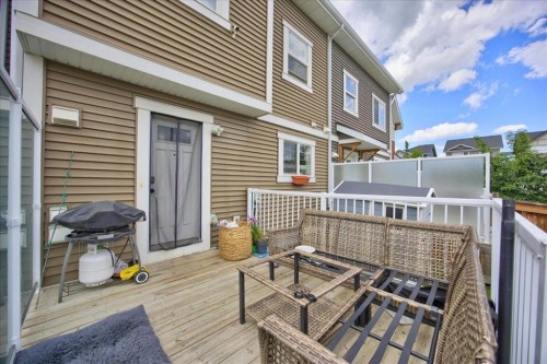 146 Sunset Road, Cochrane, AB - Outdoor With Deck Patio Veranda With Exterior