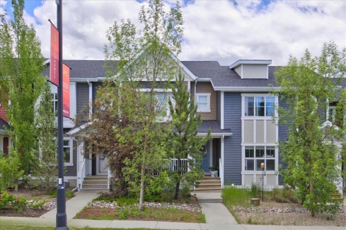 146 Sunset Road, Cochrane, AB - Outdoor With Facade