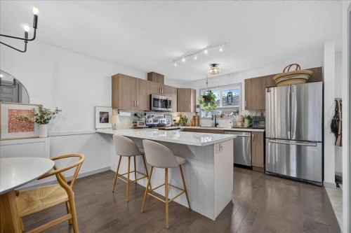 146 Sunset Road, Cochrane, AB - Indoor Photo Showing Kitchen With Stainless Steel Kitchen With Upgraded Kitchen