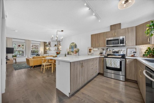 146 Sunset Road, Cochrane, AB - Indoor Photo Showing Kitchen With Stainless Steel Kitchen