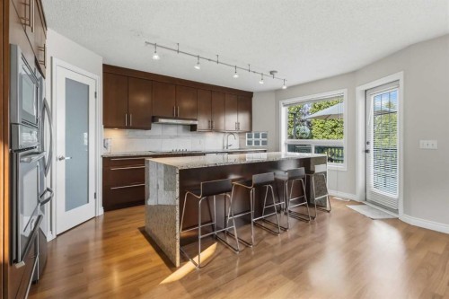 307 Hidden Cove Nw, Calgary, AB - Indoor Photo Showing Kitchen With Upgraded Kitchen