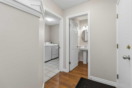307 Hidden Cove Nw, Calgary, AB - Indoor Photo Showing Laundry Room