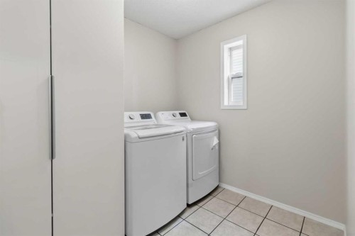 307 Hidden Cove Nw, Calgary, AB - Indoor Photo Showing Laundry Room