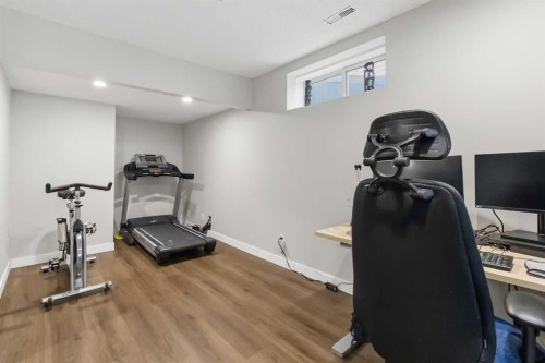 307 Hidden Cove Nw, Calgary, AB - Indoor Photo Showing Gym Room