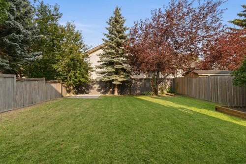 307 Hidden Cove Nw, Calgary, AB - Outdoor With Backyard