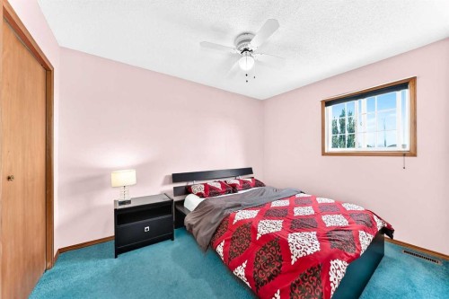 216 Millbank Road Sw, Calgary, AB - Indoor Photo Showing Bedroom