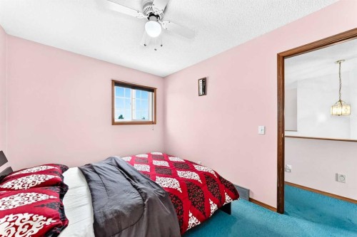216 Millbank Road Sw, Calgary, AB - Indoor Photo Showing Bedroom