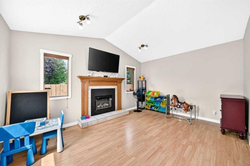 216 Millbank Road Sw, Calgary, AB - Indoor With Fireplace