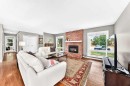 256 Midvalley Place Se, Calgary, AB  - Indoor Photo Showing Living Room With Fireplace 