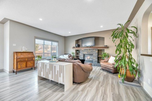 101 Hawkmere Place, Chestermere, AB - Indoor Photo Showing Living Room With Fireplace