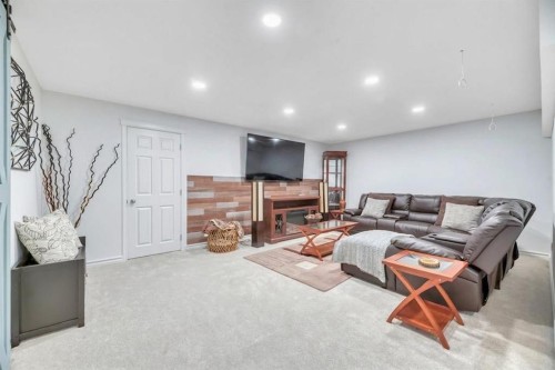 243 Westchester Boulevard, Chestermere, AB - Indoor Photo Showing Basement With Fireplace